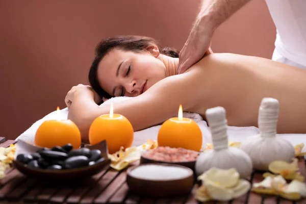 Close-up Of Therapist Hand Massaging Woman\'s Back In Spa