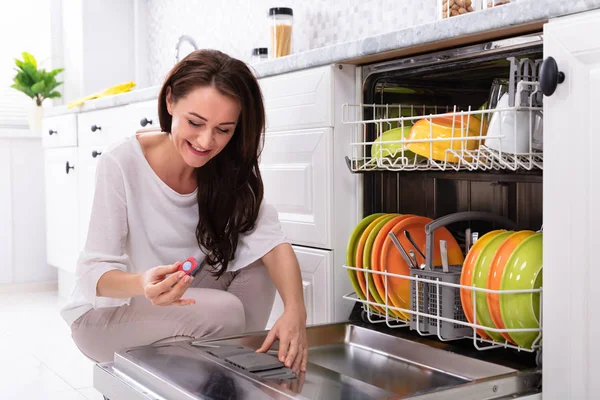Happy Young Woman Putting Soap Tablet Dishwasher Box — Stock Photo, Image