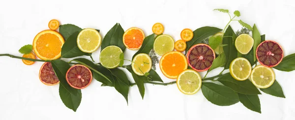 Lot Different Fresh Citrus Fruits White Crumpled Paper Background — Stock Photo, Image