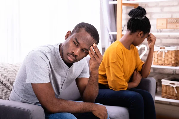 Young Depressed African Couple Sitting Sofa — Stock Photo, Image