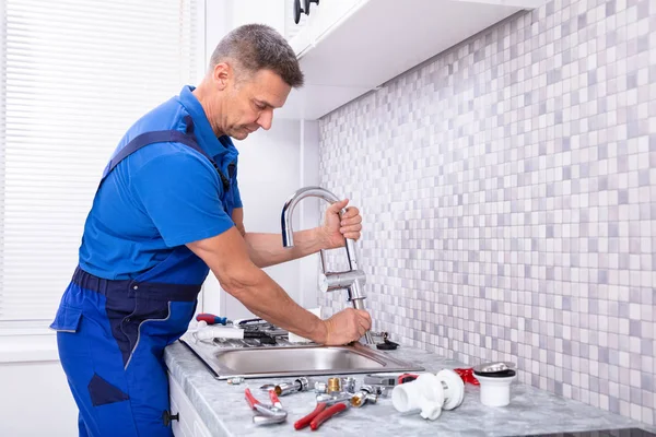 Side View Plumber Fixing Water Tap Kitchen — Stock Photo, Image