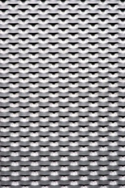 The close-up of a stamped corrugated sheet and expanded metal..... clipart