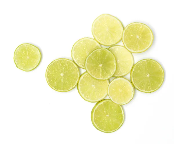 Many Fresh Lime Slices Lie Beautifully Arranged White Background — Stock Photo, Image