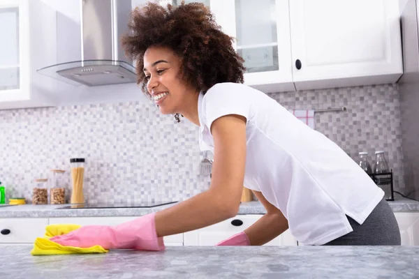 Happy African Young Woman Cleaning Dirty Kitchen Counter Spray Detergent — Stock Photo, Image