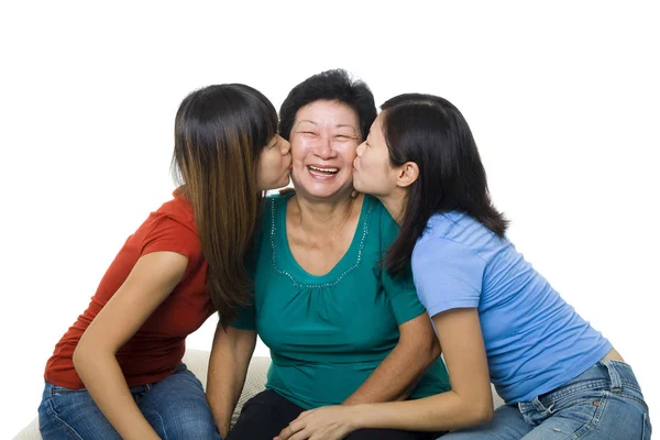 Asian Family Portrait White Background Adult Daughters Kissing Senior Mother Royalty Free Stock Photos