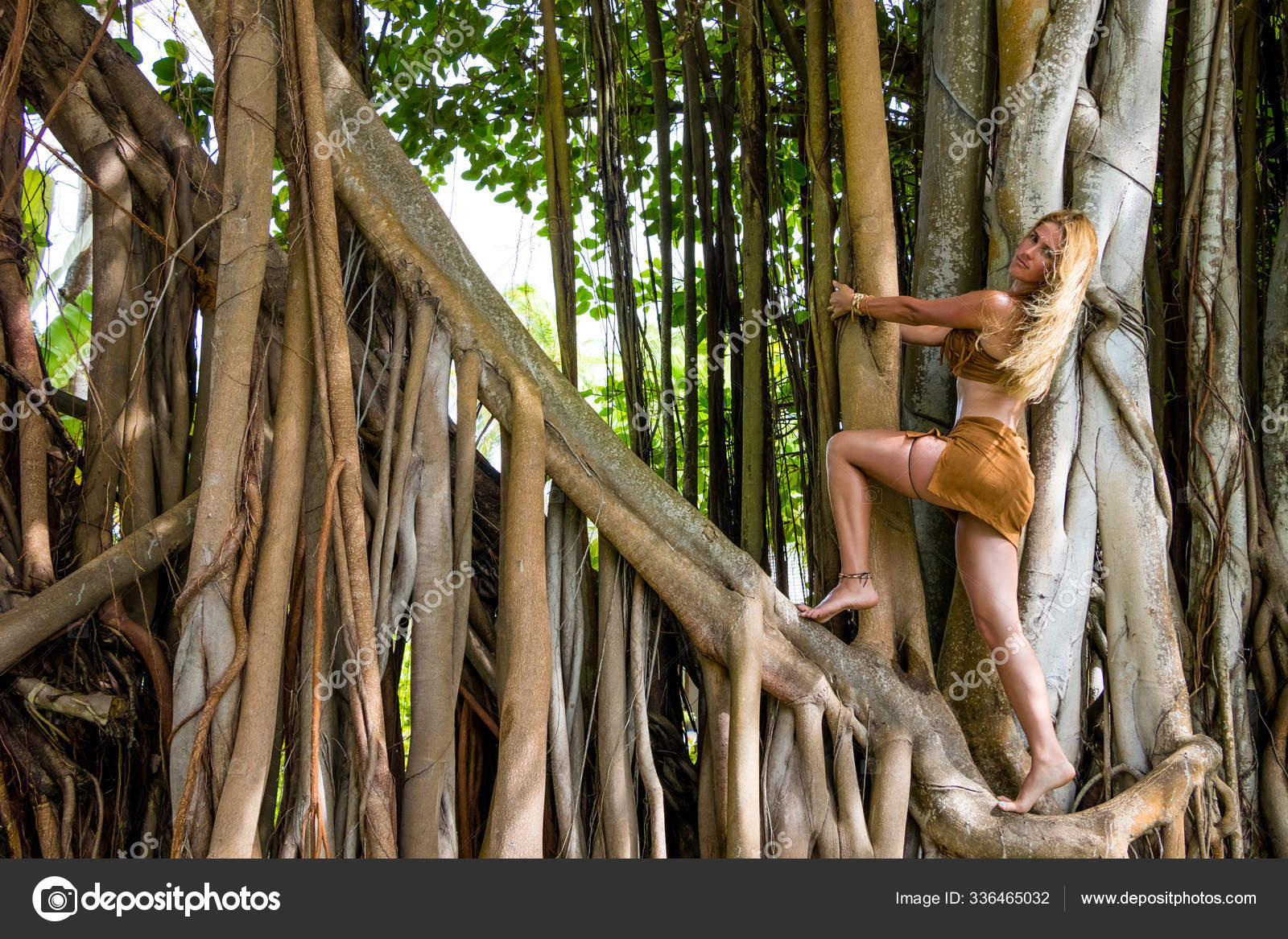 Wild Woman Climbing Trees — Stock Photo © PantherMediaSeller