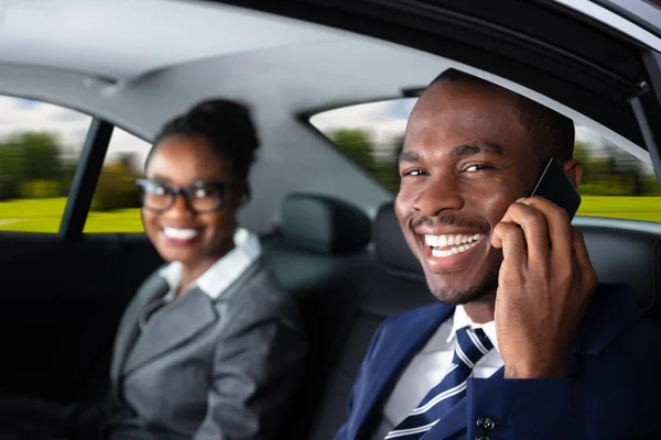 Happy Businessman Sitting Car His Female Colleague Talking Cellphone — Stock Photo, Image