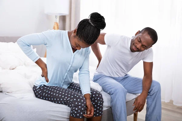 African Couple Suffering Back Pain Sitting Bed — Stock Photo, Image