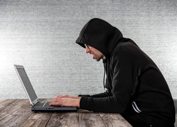 Hacker Black Hoody Laptop Front Gray Background — Stock Photo, Image