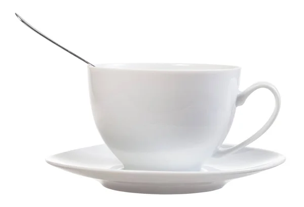 白色瓷杯的侧视图与勺子和茶托查出在白色背景 — 图库照片