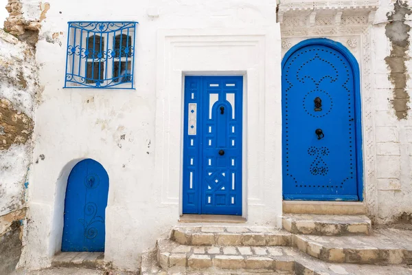Three unique blue doors in the historic medina in Sousse, Tunisia
