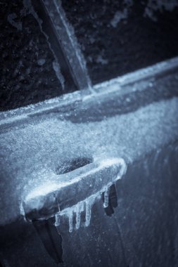 Close up shot of a car's frozen door lock. clipart
