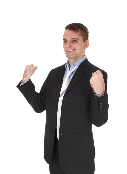 Молодой Счастливый Человек Стоящий Темном Костюме Галстуке Улыбающийся Поднятыми Кулаками — стоковое фото