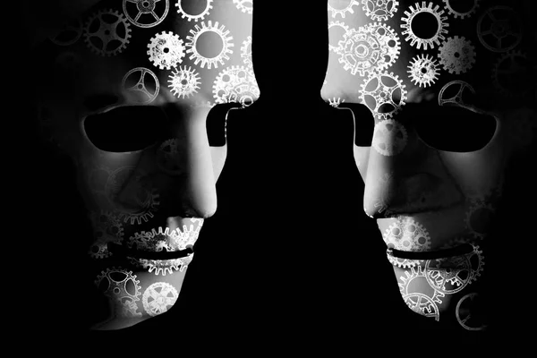 Artificial intelligence robot masks with cogs indicating mechanical brain power. Black background with space for text
