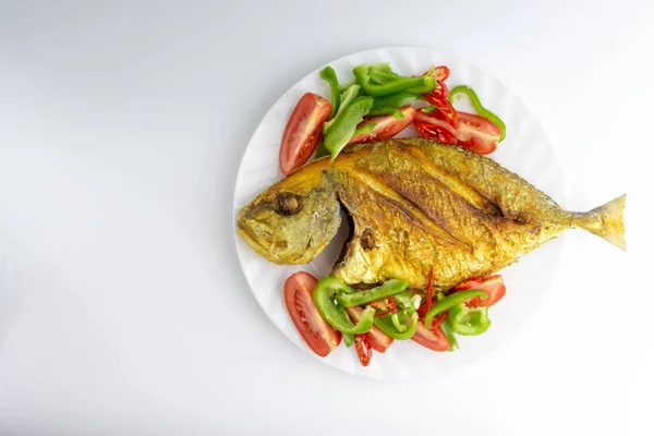 Fried fish on white background with selective focus