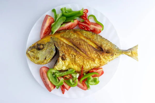 Fried fish on white background with selective focus