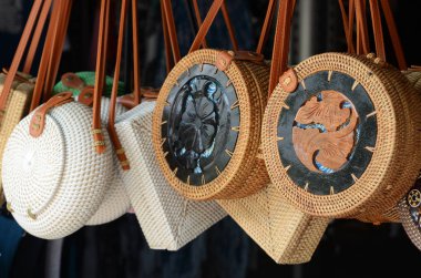 Balinese handmade rattan eco bags in a local souvenir market in Bali, Indonesia clipart