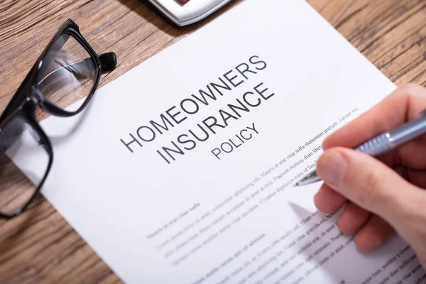 Overhead View Person Hand Filling Homeowners Insurance Policy Form Wooden — Stock Photo, Image