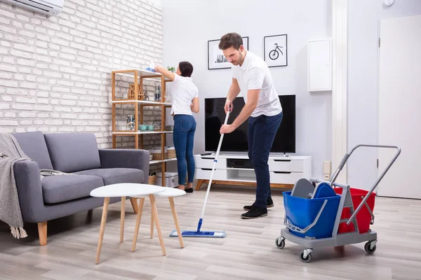 Side View Two Persons Cleaning Shelf Mopping Floor Living Room — Stock Photo, Image
