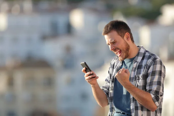 Excited Man Checking Smart Phone Content Town Sunset — Stock Photo, Image