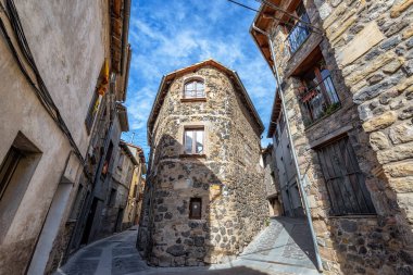 Fork in the road in the historic town of Castellfollit de la Roca, Spain clipart