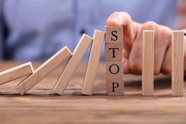 Businessperson Finger Wooden Blocks Stop Text Stop Falling Dominos Wooden — Stock fotografie