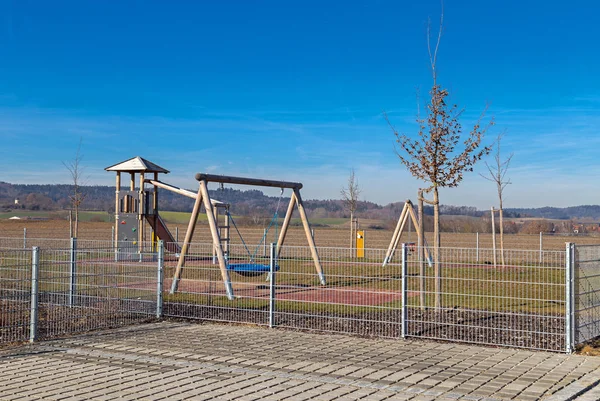 Fenced playground next to a kindergarten