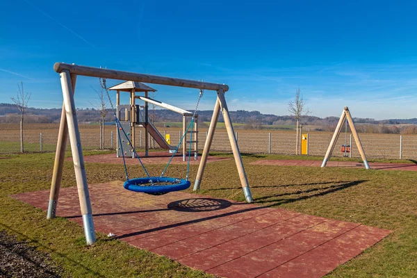 Fenced playground next to a kindergarten