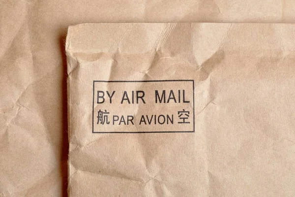 Air Mail Sign Stamped Package Also Written Out French Chinese — Stock Photo, Image