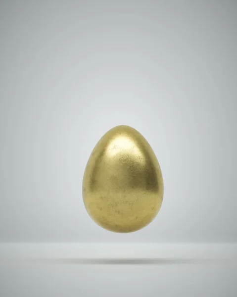 Złote Jajko Wielkanocne Szarym Tle Zbliżeniu Zrównoważony Pionowo Jego Tępym — Zdjęcie stockowe