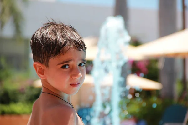 Little Boy Blurred Background Swimming Pool Fountain Holiday Hotel Sunny — Stock Photo, Image