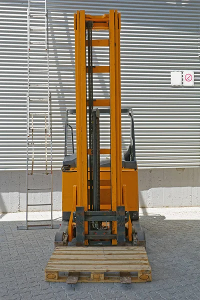 Euro Pallet at Forklift Stacker Truck in Warehouse