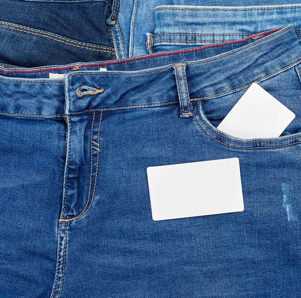 Empty Paper Card Lies Blue Jeans Full Frame Stock Image