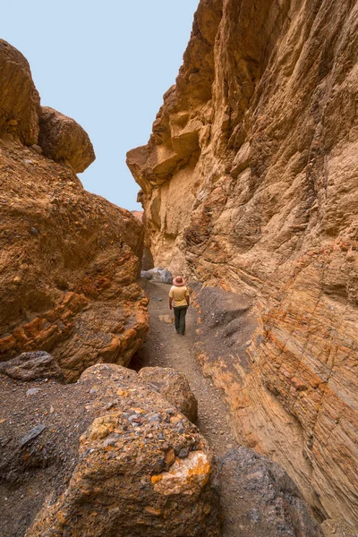 Hiking Through a Narrow Canyon in Mosaic Canyon in Death Valley National Park in California