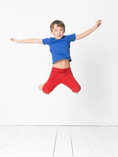 Cool Young Cute Boy Blue Shirt Red Trousers Jumping High Stock Picture