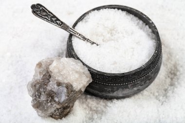 old silver salt cellar with spoon, raw natural Halite mineral and grained Rock Salt close up clipart