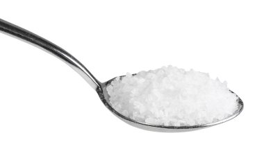 tablespoon with coarse grained Sea Salt close up isolated on white background clipart