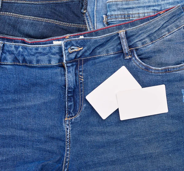 Empty Paper Card Lies Blue Jeans Full Frame Royalty Free Stock Images