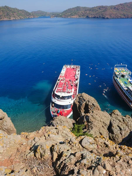 Recreation on the boat near the shore of a mountain