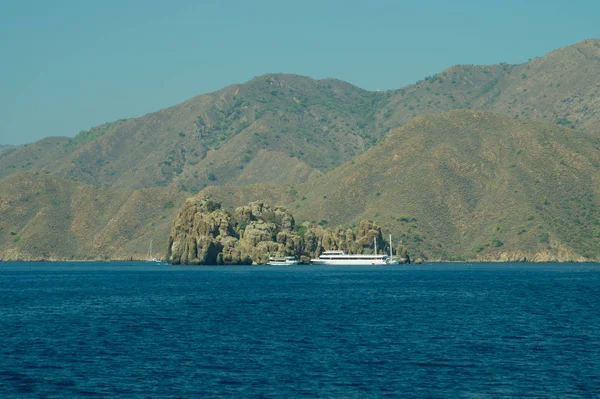 Recreation on the boat near the shore of a mountain