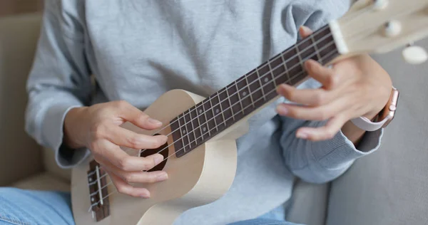 stock image Woman play with ukulele at home