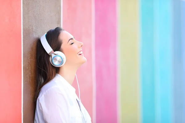 Side View Portrait Happy Girl Relaxing Listening Music Colorful Wall — Stock Photo, Image