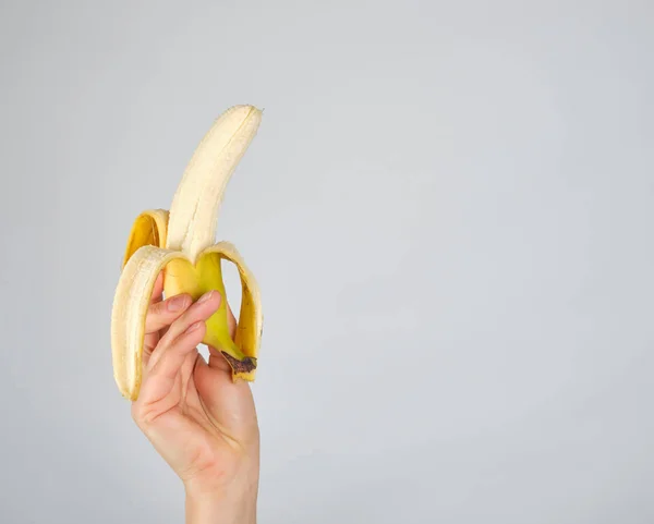 Peeled Fresh Yellow Banana Female Hand White Background Copy Space — Stock Photo, Image