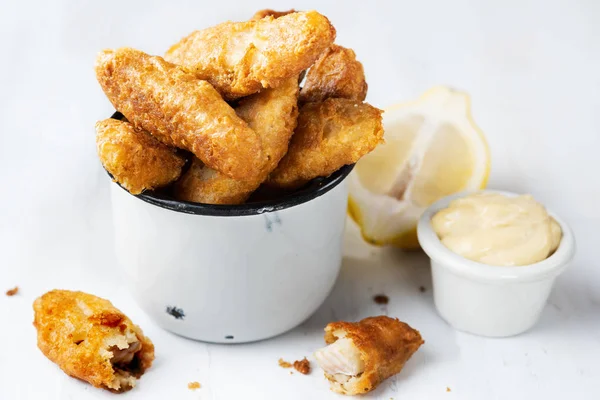 stock image close up of rustic golden breaded fish fingers