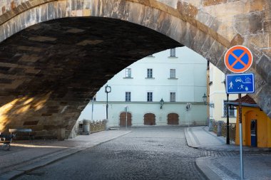 Street under the Charles Bridge in Prague clipart