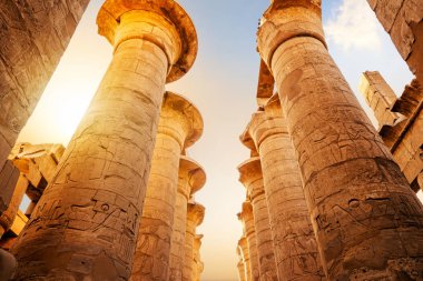 Great columns in Luxor Temple at sunrise clipart