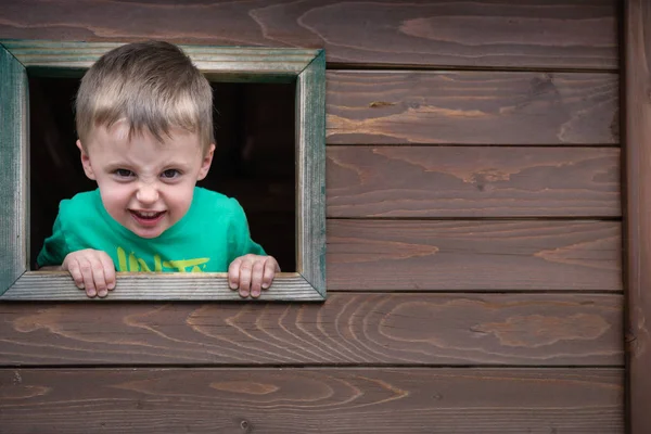 Portrait Cute Cheeky Little Caucasian Boy Looking Window Wooden Toy Stock Photo