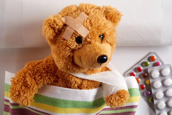 Injured Teddy Bear Arm Sling Plaster Its Head Lying Bed Stock Image