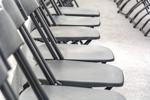 Rows Black Folding Chairs Empty Conference Room — Stock Photo, Image