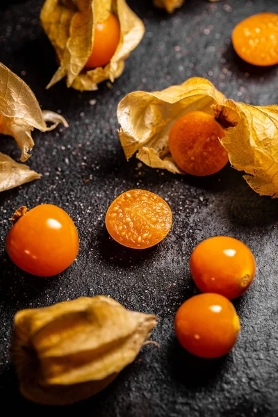 Cape gooseberries with calyx on black background